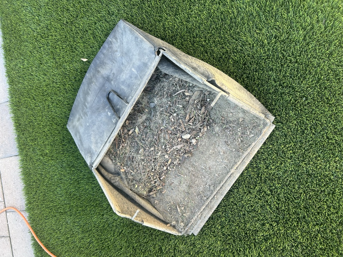 artificial turf cleaning company treating a pet turf yard in Poway CA